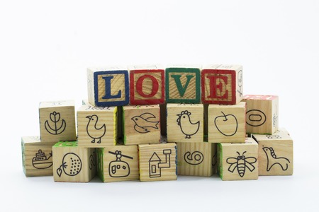 Wooden toy blocks spelling I love you isolated on a white backgroundの写真素材