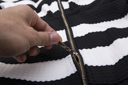 zipper in the black cloth and whiteの写真素材