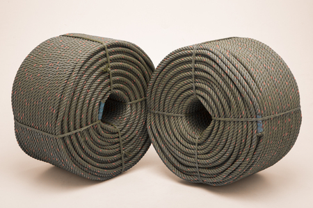 large roll with new green rope for the shipping industryの写真素材