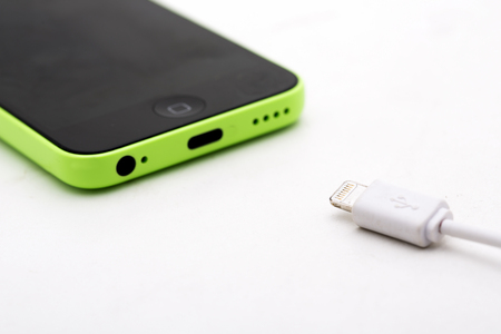 Different usb charging plugs on a white backgroundのeditorial素材