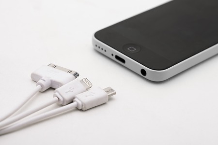 Different usb charging plugs on a white backgroundのeditorial素材