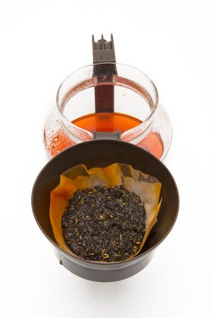 Cup of tea with a teapot on a white background.の写真素材