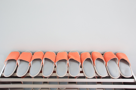 Shoes on the shelves in the hallway in the house for the whole family.の写真素材