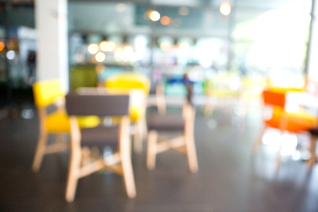 Dining area with colorful tables and chairsの写真素材