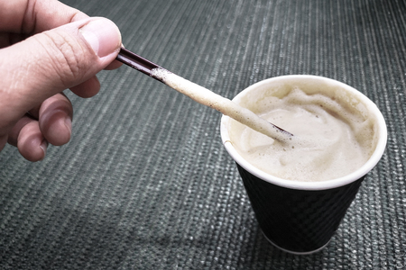 Cappuccino coffee in a glass of paper.の写真素材