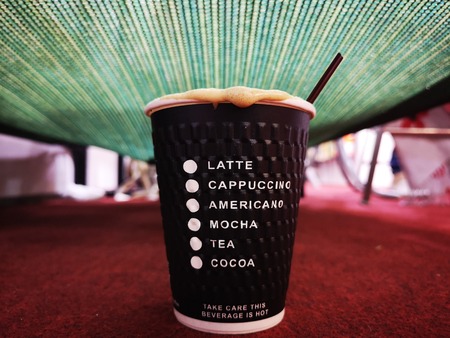 Cappuccino coffee in a glass of paper.の写真素材