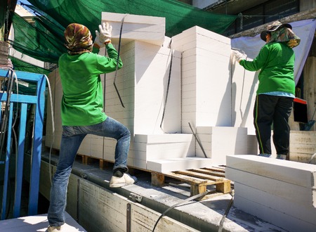 White rectangular bricks, including decorative brick on an outdoor pallet.