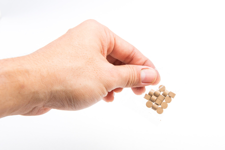 Herbal tablets in handの写真素材