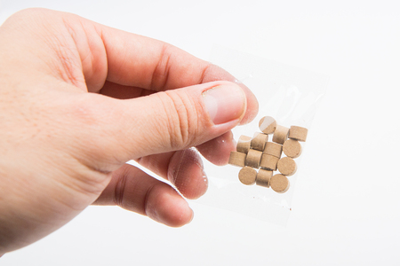 Herbal tablets in handの写真素材