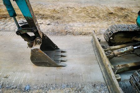 Excavators with tanks at the road construction area