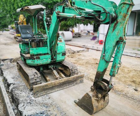 Excavators with tanks at the road construction areaの写真素材