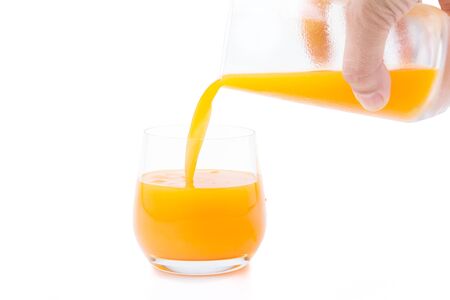 Freshly squeezed orange juice on a white backgroundの写真素材