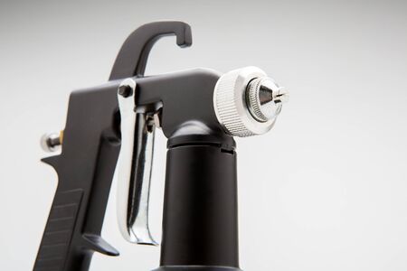 A spray gun on a white background