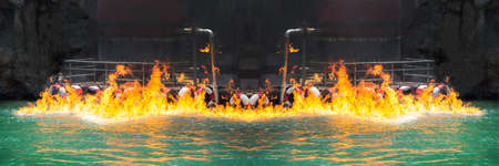 Red flames stuck oil on the surface of the water.