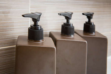 Brown pump bottle, shampoo and liquid soap
