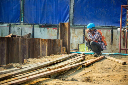 Workers working on the electric train construction siteのeditorial素材