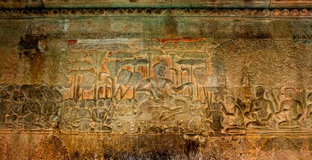 The low relief carvings surrounding Angkor Wat belong to the Khmer Empire. Located in the center of Angkor Thomの写真素材