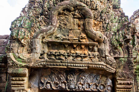 The low relief carvings surrounding Bayon Castle belong to the Khmer Empire. Located in the center...