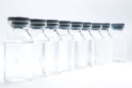 a bottle of vaccine on a white backgroundの写真素材