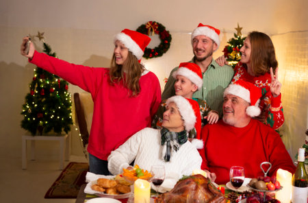 A happy family holds a Christmas party at home on the holiday.の写真素材