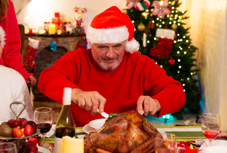 Grandpa is having a happy Christmas party at home on the holiday.の写真素材