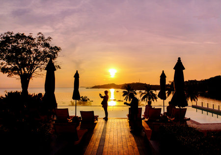Morning sunrise view, swimming pool overlooking the seaの写真素材