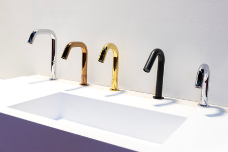 Stainless steel sink faucets on display for sale in the booth