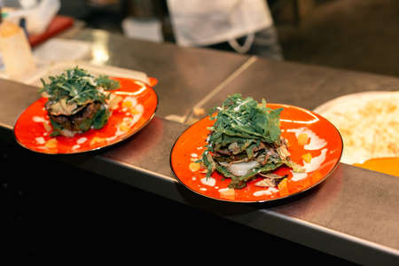 two fresh salad on orange plates. flat lay. copy space