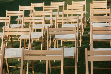 Stylish wooden chairs. Luxurious decor for a white wedding ceremony.の写真素材