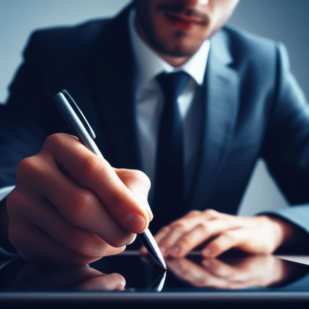 Hands of a businessman signing some documents, transaction concept through handwriting, identification through signatureの素材