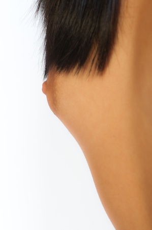 Closeup of female breasts over white backgroundの写真素材