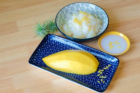 mango with sticky rice, Thai dessert, wooden backgroundの写真素材