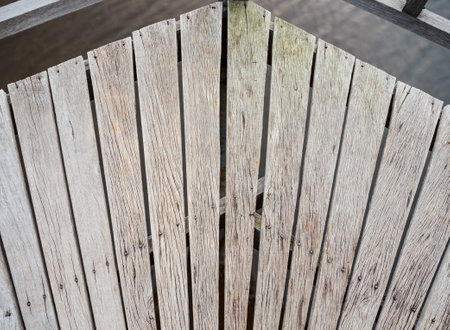 This photo displays the flooring design of a turn on a wooden bridge.