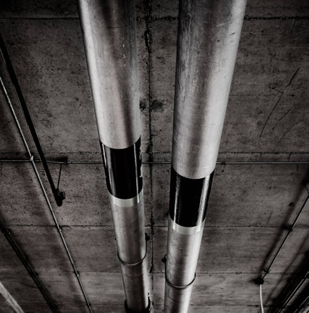 Pipes on the ceiling of a garage,  processed in grunge style