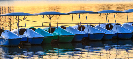 Water cycle boats in a lake. This photo is taken at a public park.