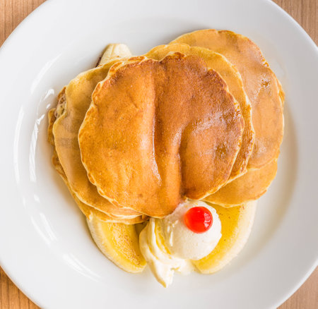 Pancake, banana, and butter as breakfastの写真素材