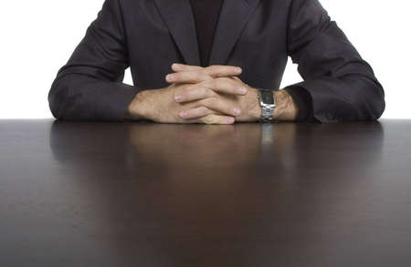 businessman hands resting on top of his deskの写真素材