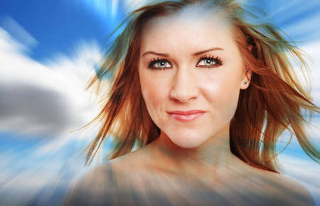 a beautiful girl is wearing white against cloud backgroundの写真素材