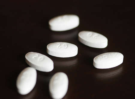 white pills spread out on a table