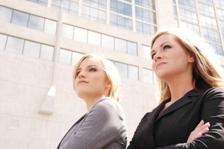 business woman posing in front of a skyscraper in downtown denverの写真素材