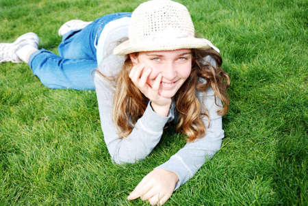 young girl is enjoying herself at outdoor locationの写真素材