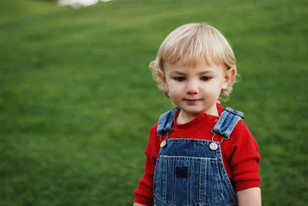 a little kid is enjoying his time in the parkの写真素材