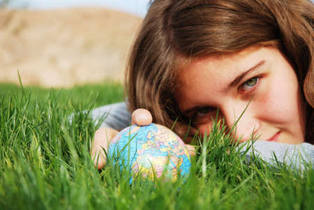 young girl is enjoying herself at outdoor locationの写真素材