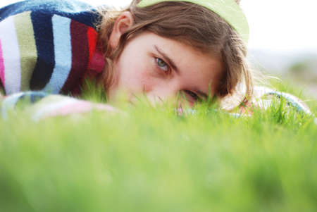 young girl is enjoying herself at outdoor locationの写真素材