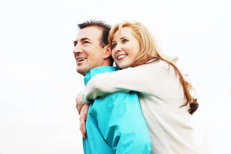 happy couple is smiling against white background