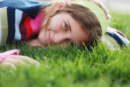 young girl is enjoying herself at outdoor locationの写真素材