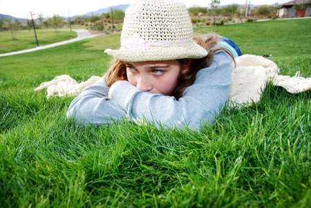 young girl is enjoying herself at outdoor locationの写真素材