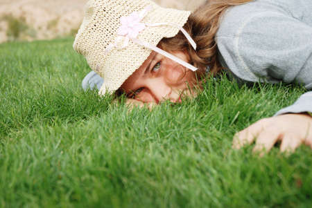 young girl is enjoying herself at outdoor locationの写真素材