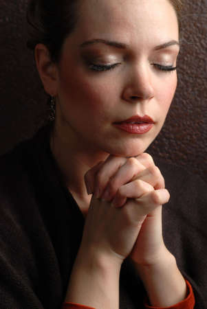 a woman is praying to god with hope