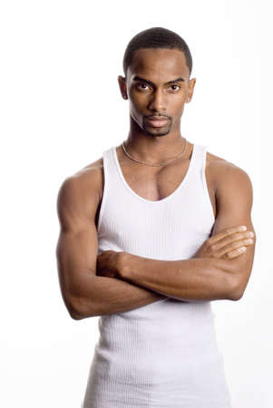 a muscular model is posing against white backgroundの写真素材